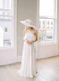 wide white straw hat with silk flowers and bow, twigs and honey
