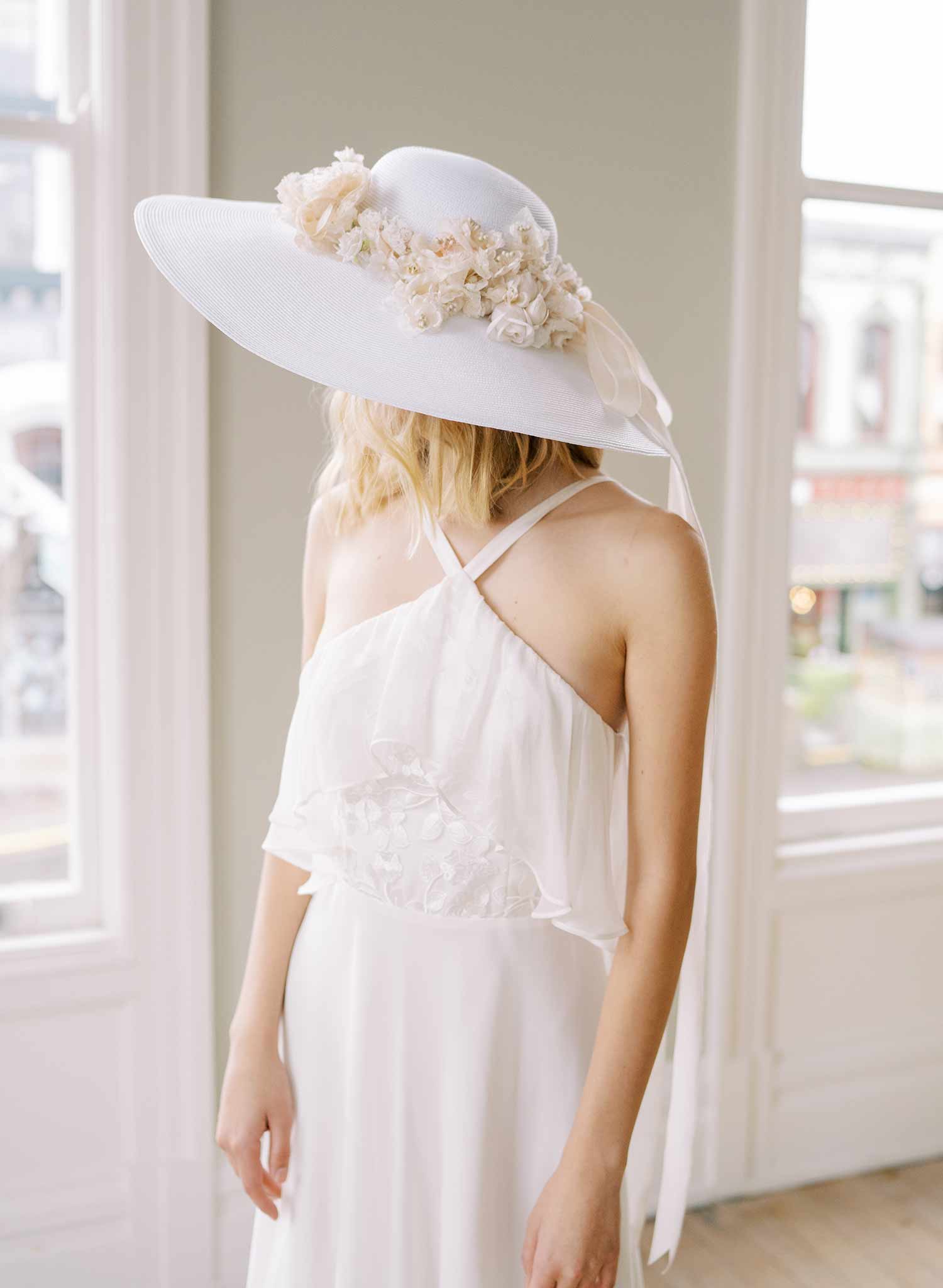 wide white straw hat with silk flowers and bow, twigs and honey