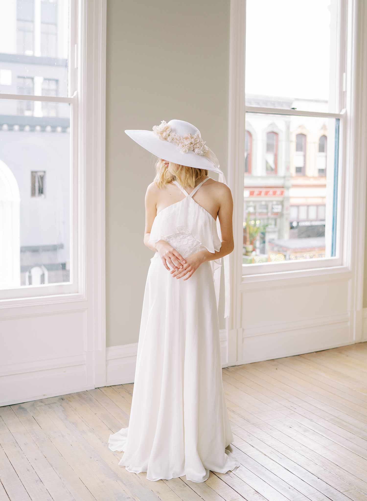 wide white straw hat with silk flowers and bow, twigs and honey