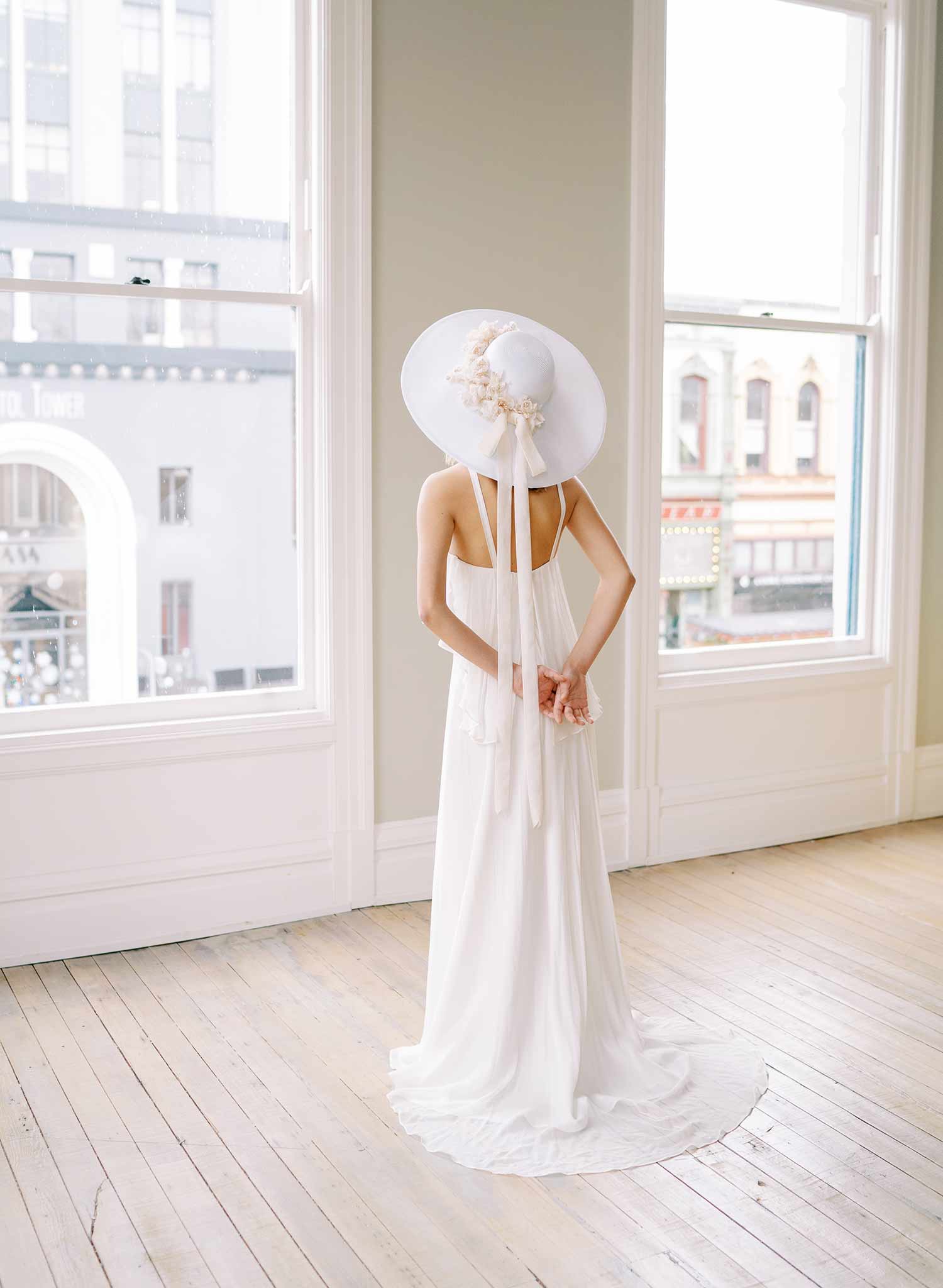 wide white straw hat with silk flowers and bow, twigs and honey