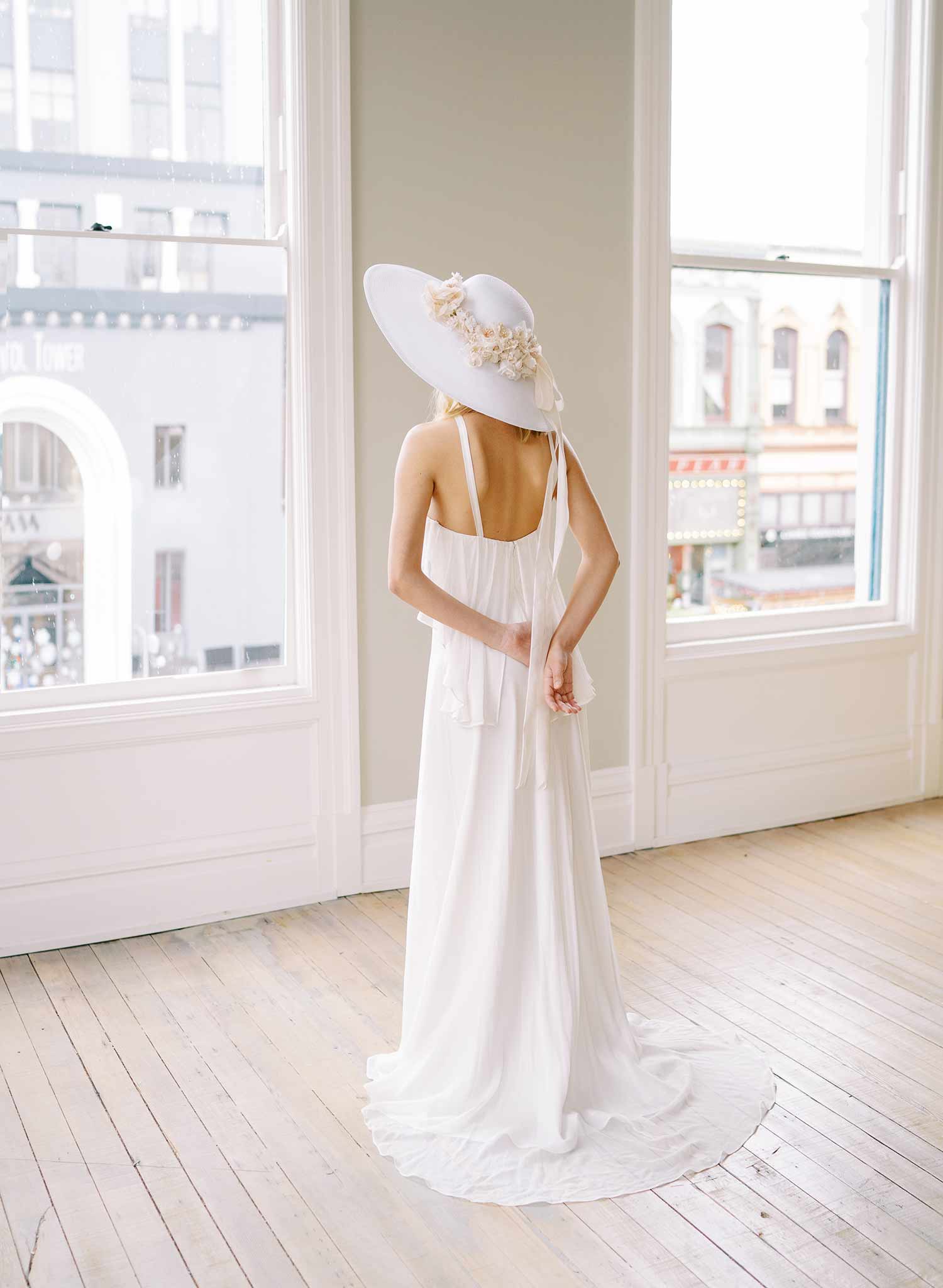 wide white straw hat with silk flowers and bow, twigs and honey