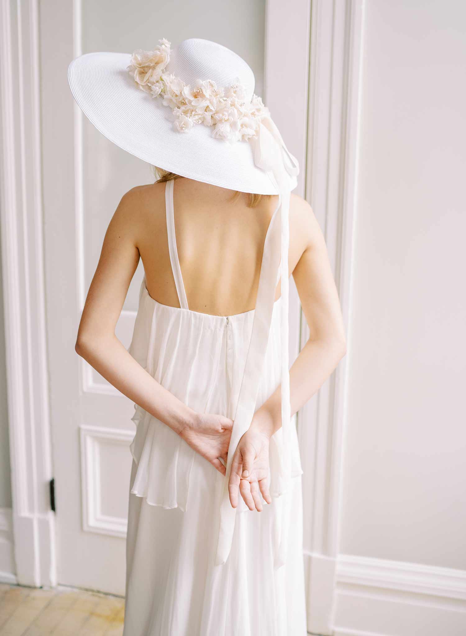 wide white straw hat with silk flowers and bow, twigs and honey
