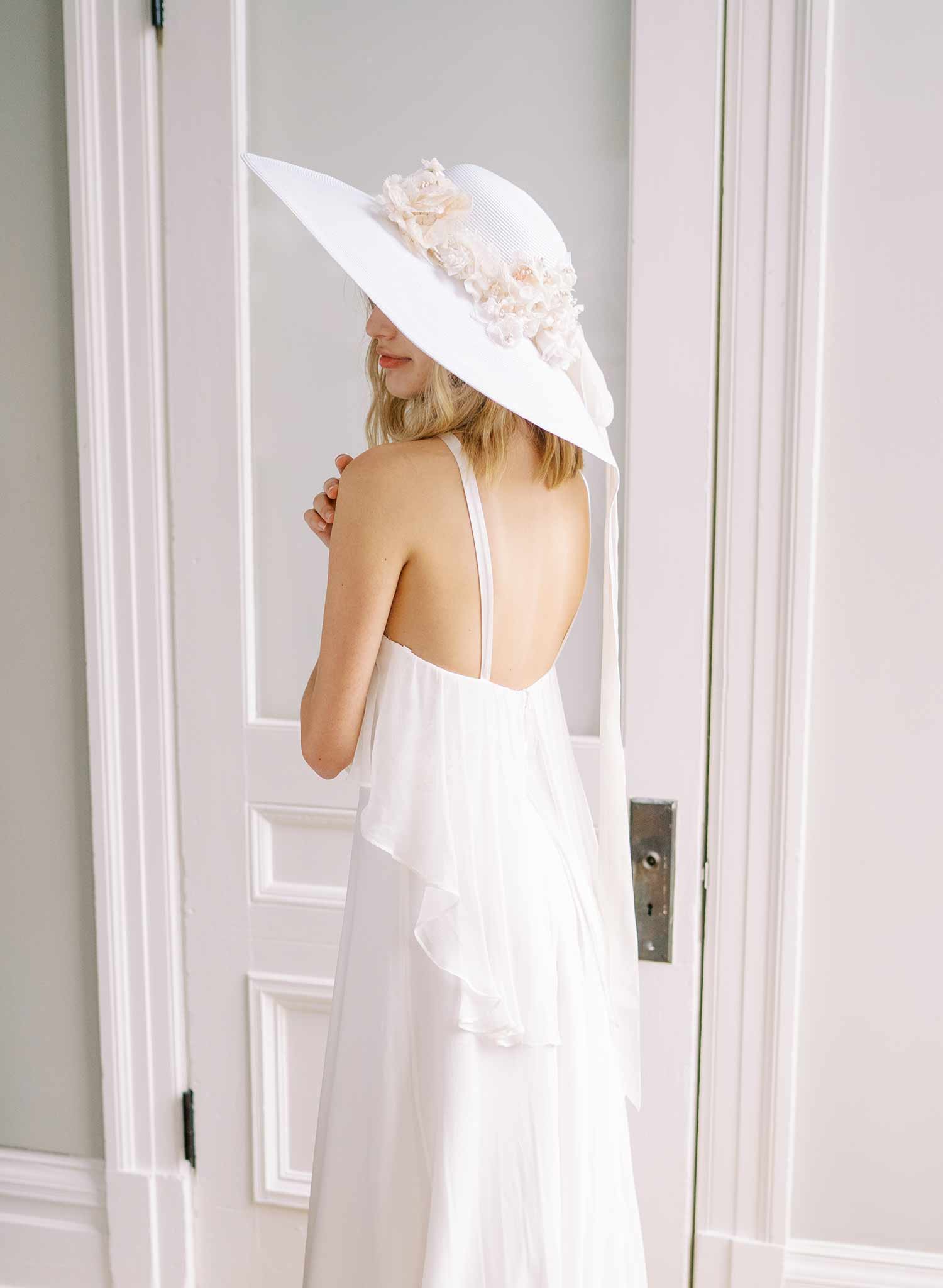 wide white straw hat with silk flowers and bow, twigs and honey