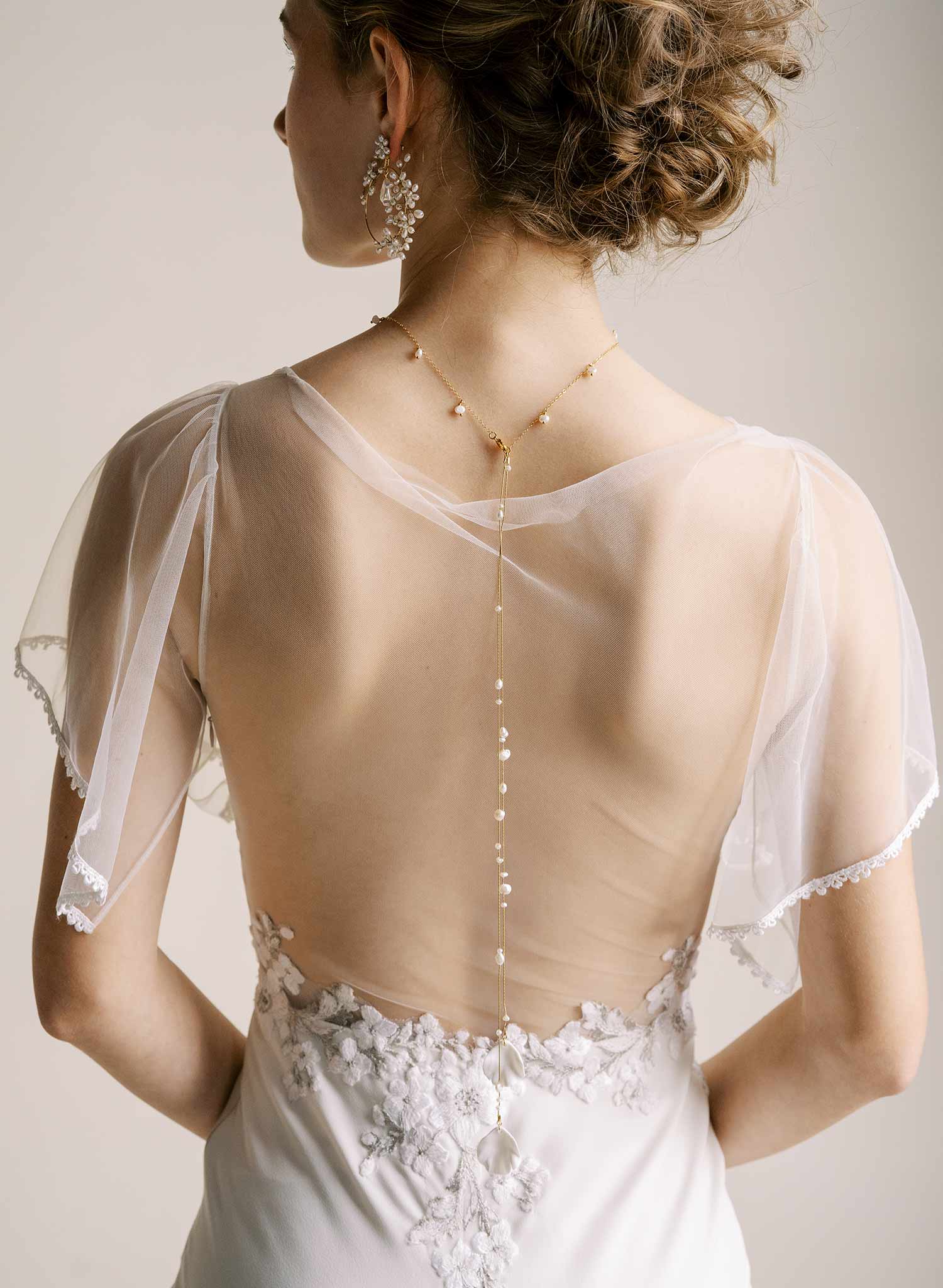 Delicate bridal gold chain necklace with freshwater pearls and floral petals by Twigs & Honey