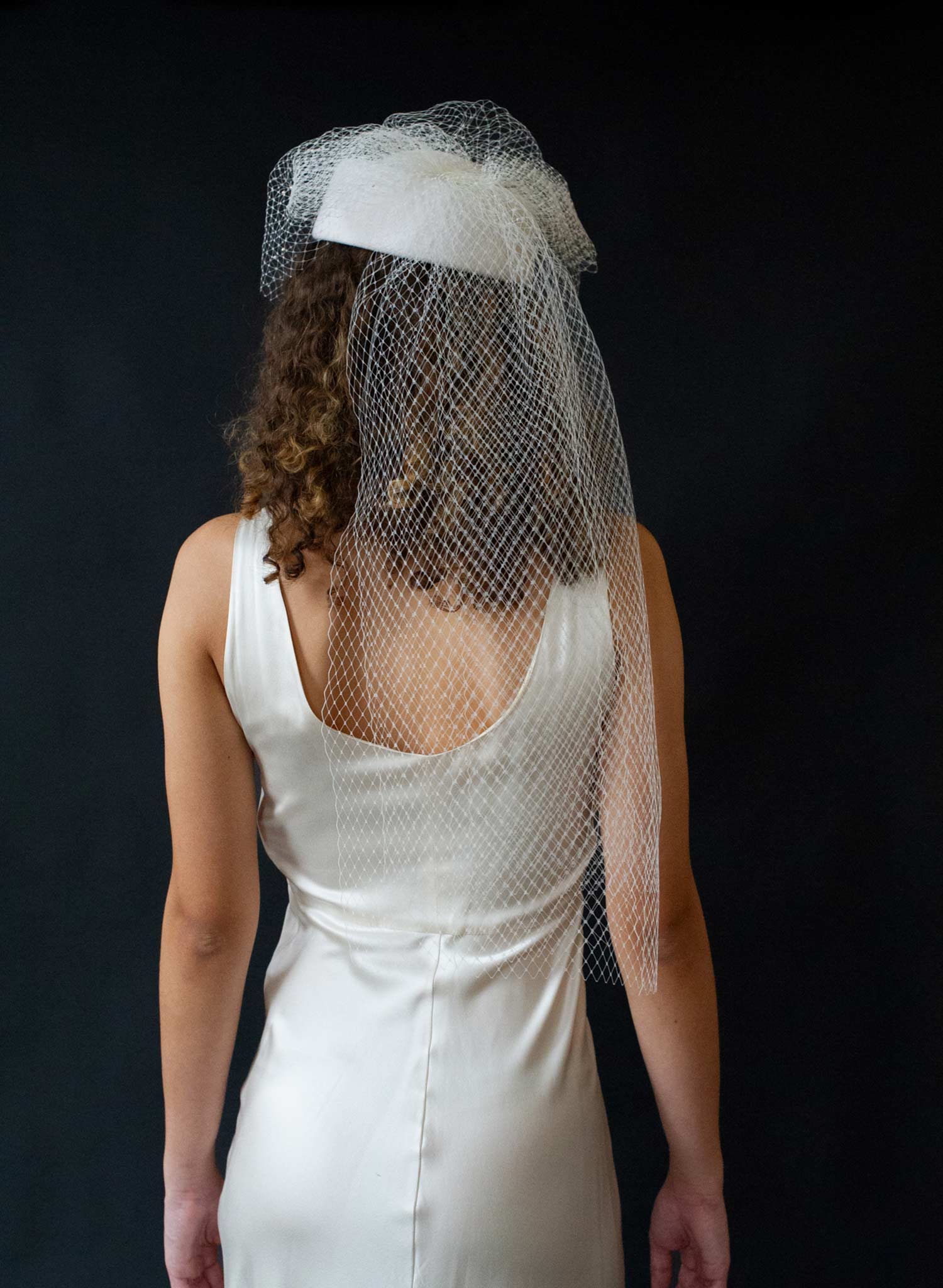 Bridal pillbox hat with pearl speckled veil - Style #2675