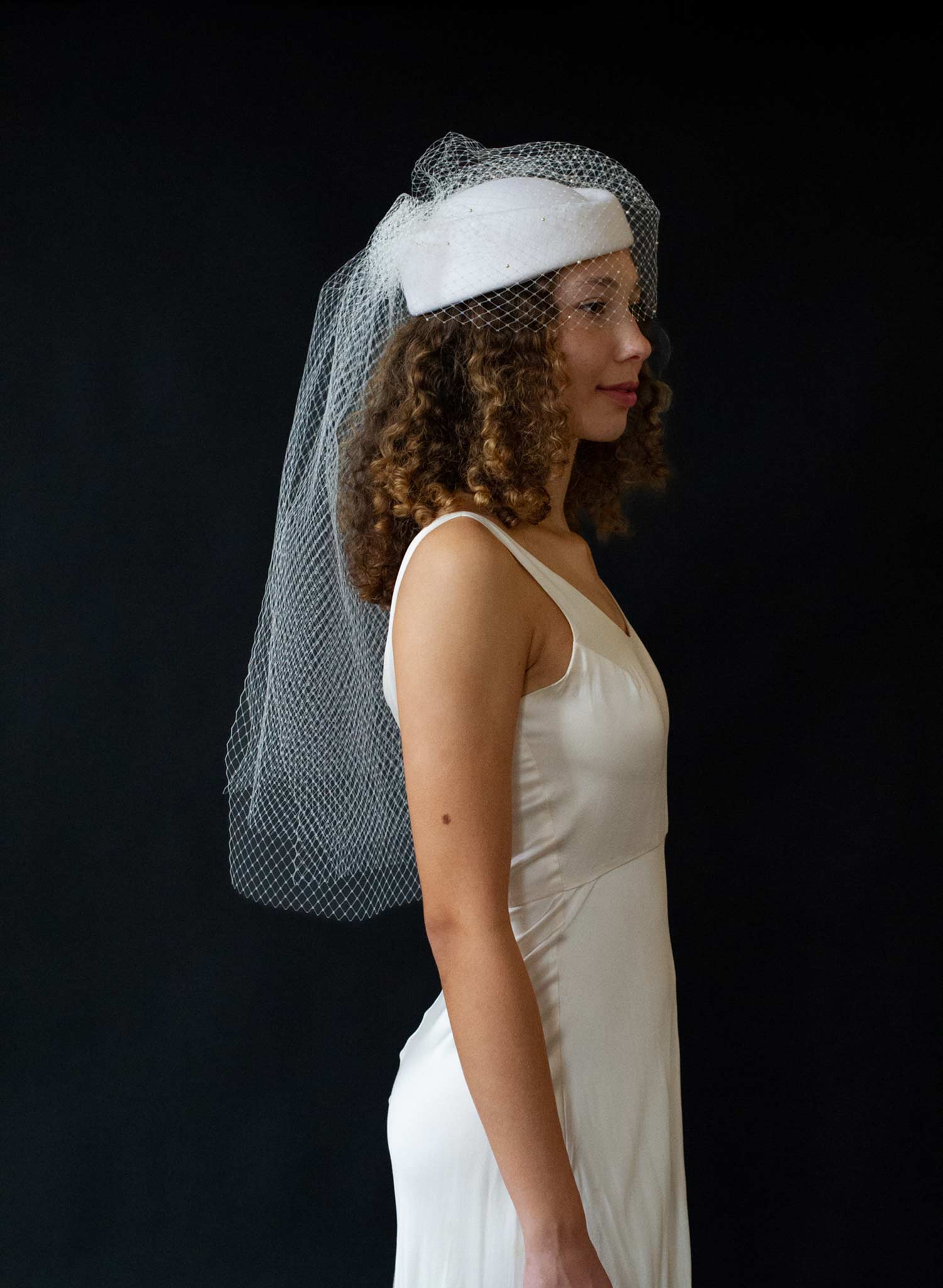 Bridal pillbox hat with pearl speckled veil - Style #2675
