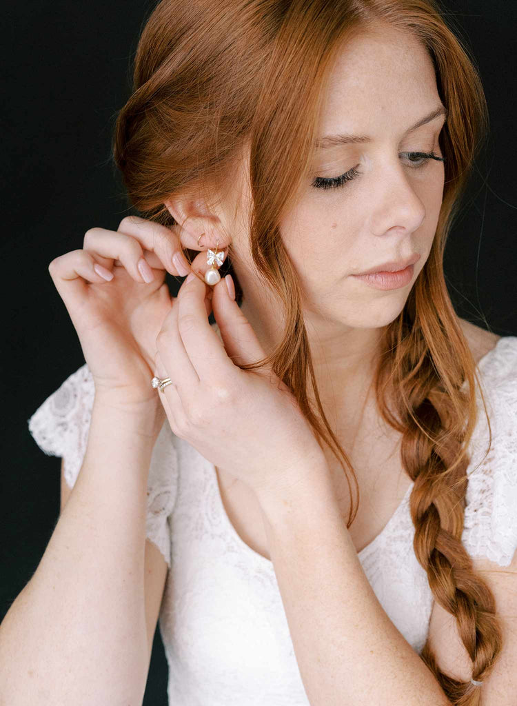 pearl and crystal bow bridal earrings by twigs and honey