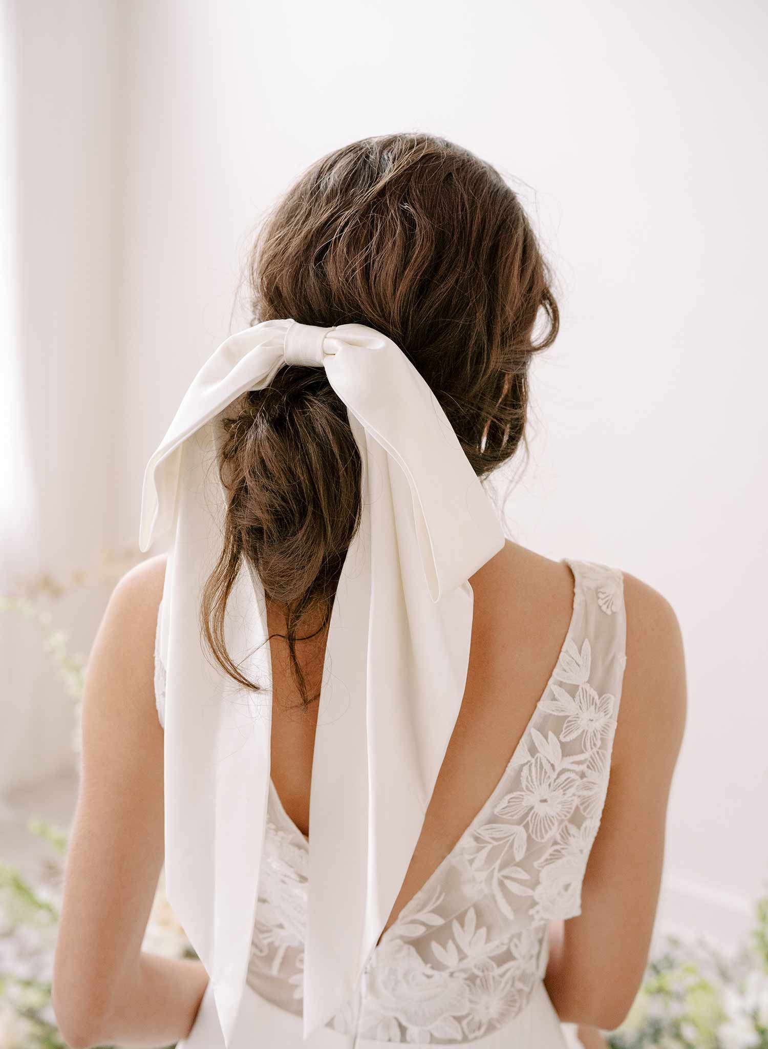 https://www.twigsandhoney.com/cdn/shop/products/2364-silk-long-bridal-hair-bow-accessory-twigsandhoney-f_2048x2048.jpg?v=1671517929